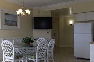 Suite dining table, kitchen and wall mounted television