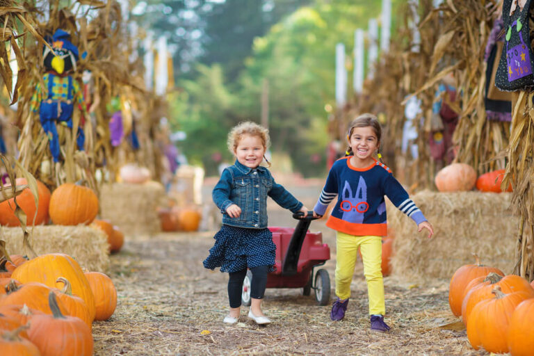 Kids pulling wagon at fall festivals in Fort Myers